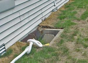 old concrete window well of a Frederick crawl space