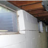 A foundation showing severe inward buckling along the windows in a Ellicott City home.