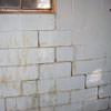 A cracked foundation wall near a window in a Staunton home