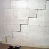 A diagonal stair step crack along the foundation wall of a Charlottesville home