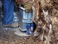 Securing a foundation footing bracket for a foundation repair system in Columbia.