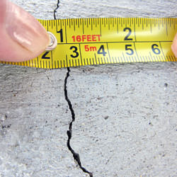 A crack in a poured concrete wall that's showing a normal crack during curing in Spotsylvania