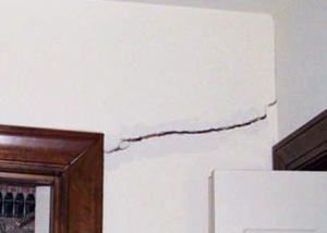 A large drywall crack in an interior wall in Fredericksburg