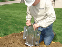 Fastening an earth anchor for a severely bowing wall in Roanoke.