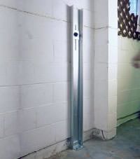 A failing foundation wall repaired with a foundation wall channel anchor system in a Arlington home.