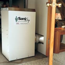A basement dehumidifier with an ENERGY STAR® rating ducting dry air into a finished area of the basement  in Spotsylvania