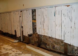 A wet, flooded finished basement in Danville