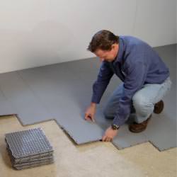 basement subfloor tiles being installed by a contractor in Christiansburg
