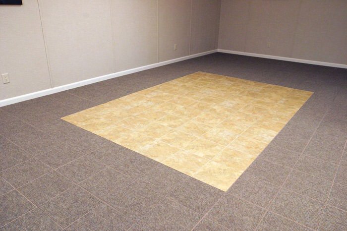 tiled and carpeted basement flooring installed in a Sterling home